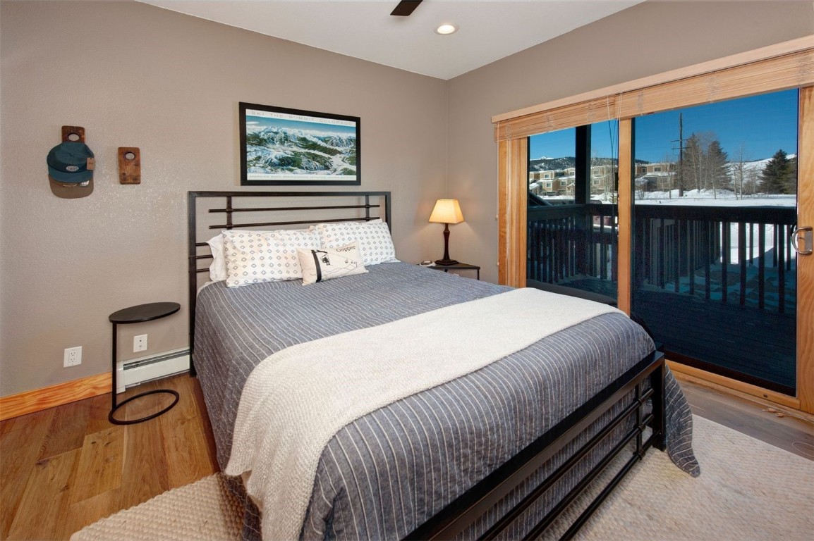 164 Buck Ridge Road, Unit 164 Summit Cove, CO 80435 - Photo 14 of 28 a bedroom with a bed and a cabinets