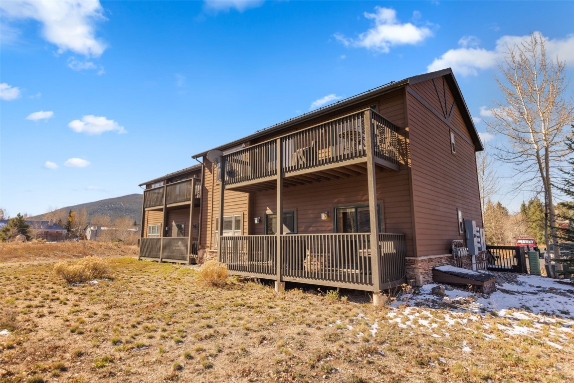 164 Buck Ridge Road, Unit 164 Summit Cove, CO 80435 - Photo 19 of 28 a view of a house with a yard