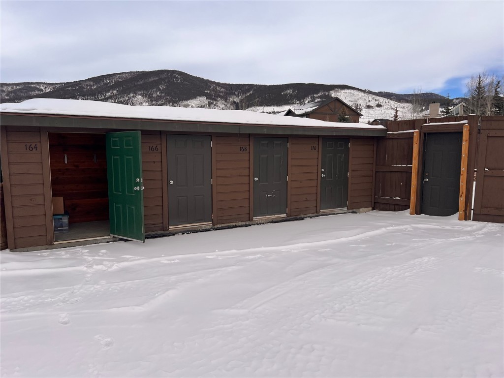 164 Buck Ridge Road, Unit 164 Summit Cove, CO 80435 - Photo 20 of 28 a view of a house with a garage