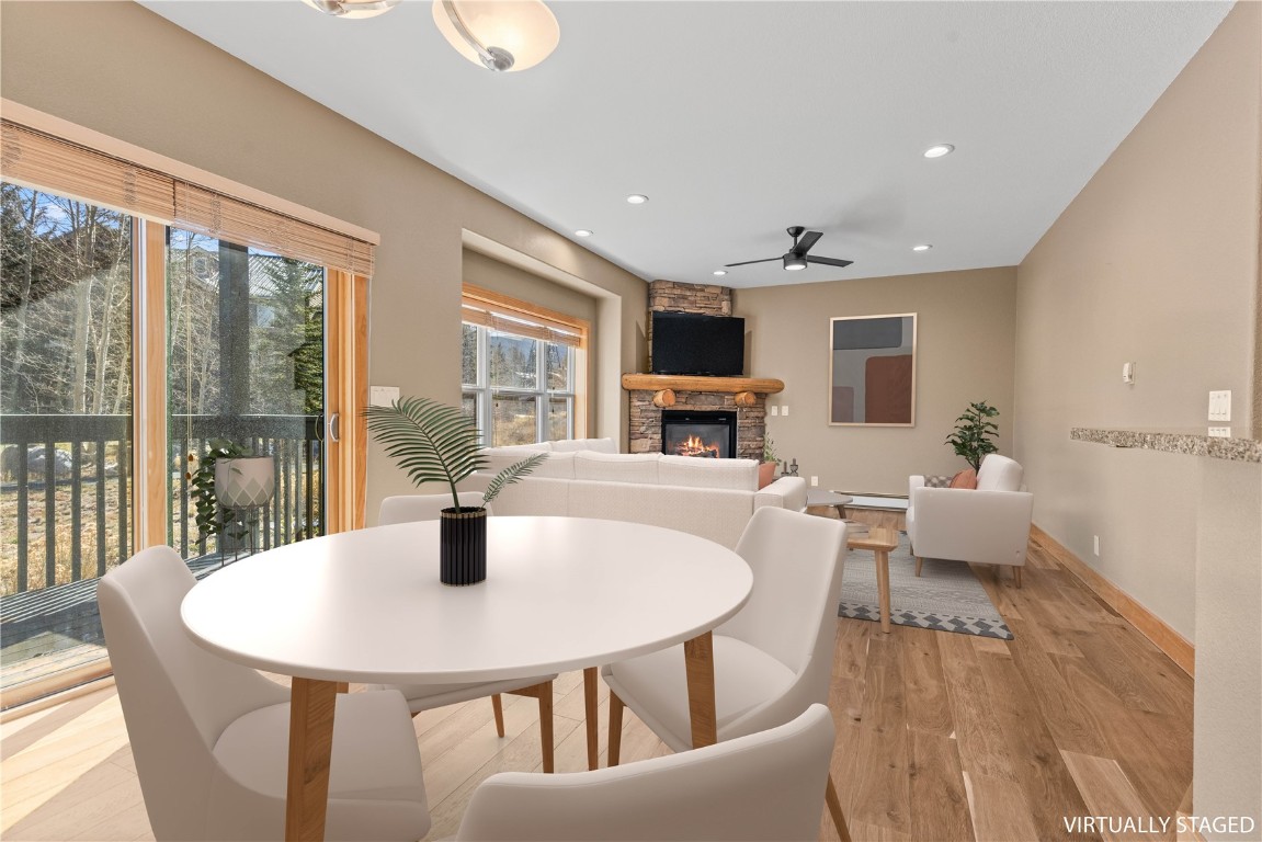 164 Buck Ridge Road, Unit 164 Summit Cove, CO 80435 - Photo 2 of 28 a dining room with furniture a window and wooden floor