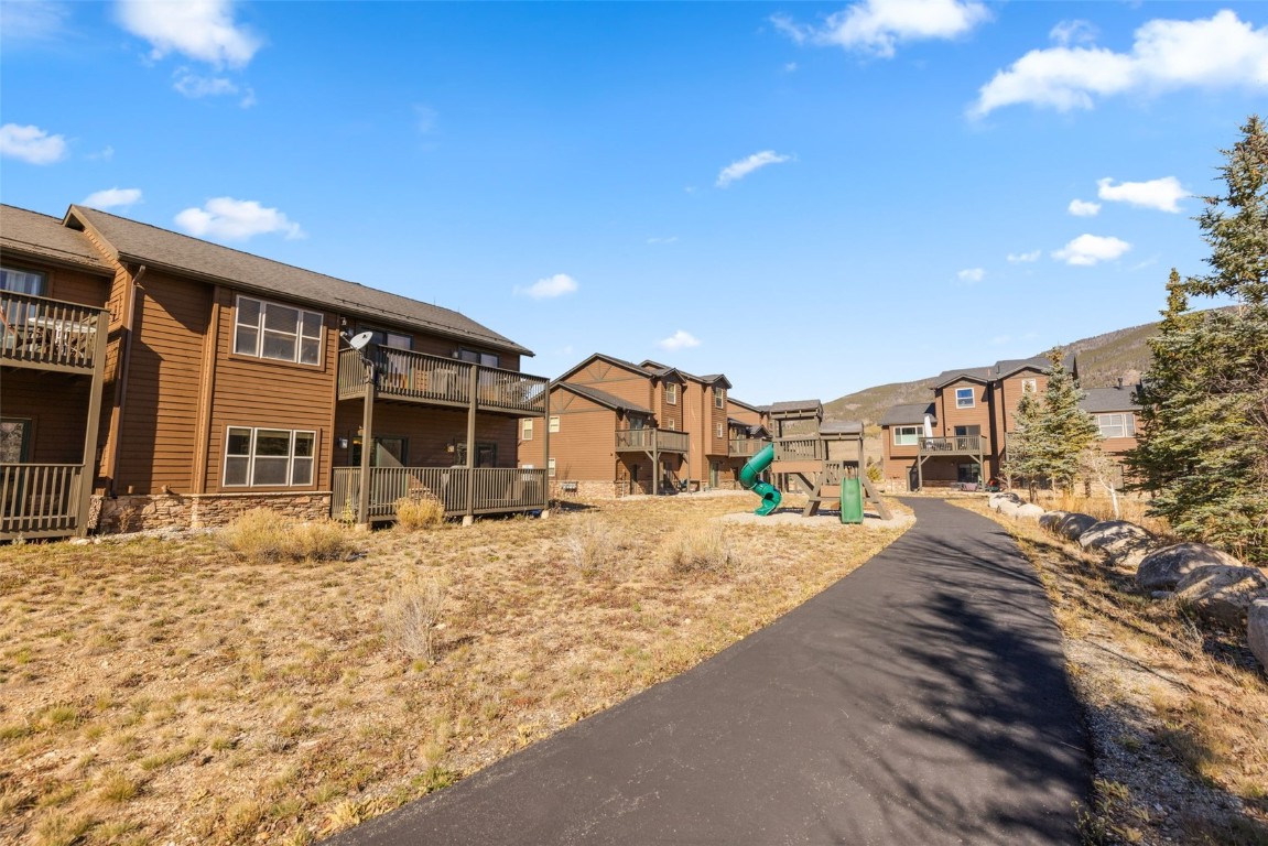 164 Buck Ridge Road, Unit 164 Summit Cove, CO 80435 - Photo 6 of 28 a front view of a house with a yard