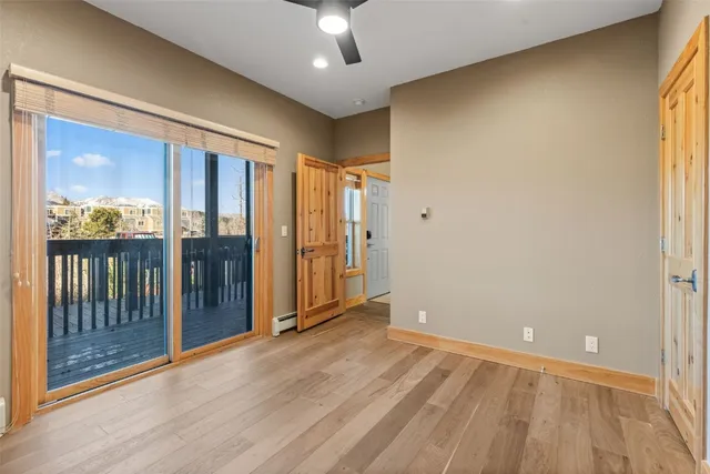 a view of an empty room with glass door