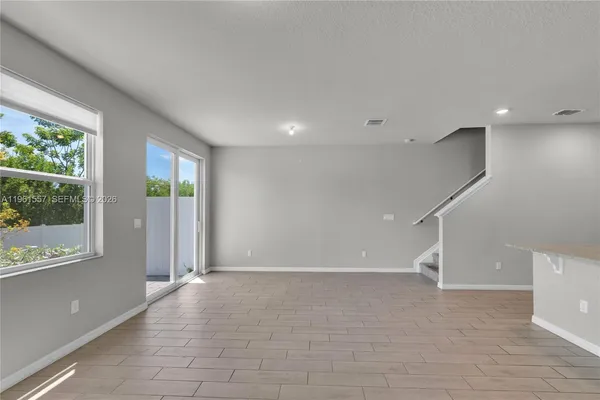 a view of an empty room with a window