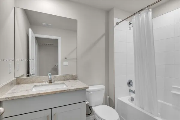 a bed room with furniture and a window