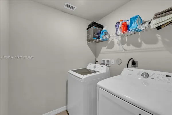 an empty room with closet and a glass door shower