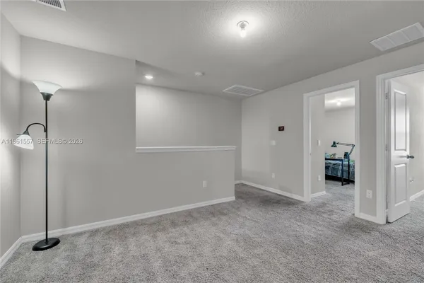 a bathroom with a sink a mirror and a toilet