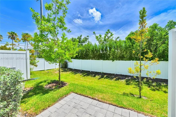 a view of a backyard with a trampoline
