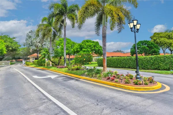 a view of a swimming pool with a yard
