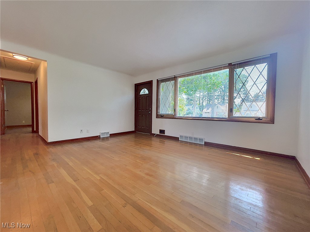 24000 Knickerbocker Road Bay Village, OH 44140 - Photo 11 of 27 Unfurnished room with light hardwood flooring
