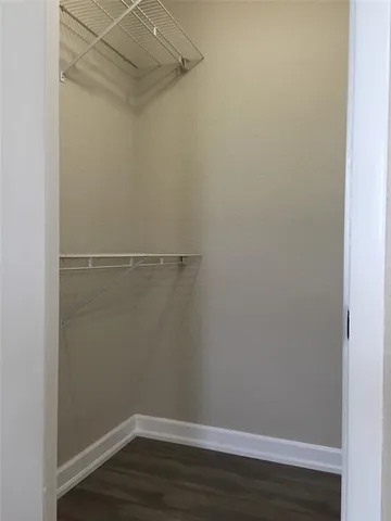 a view of a room with racks on the wall