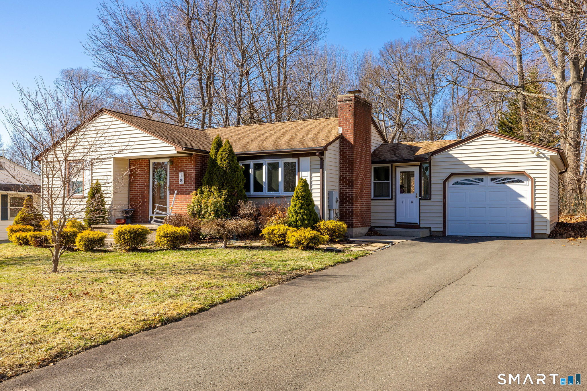 a view of a house with swimming pool and porch with furniture