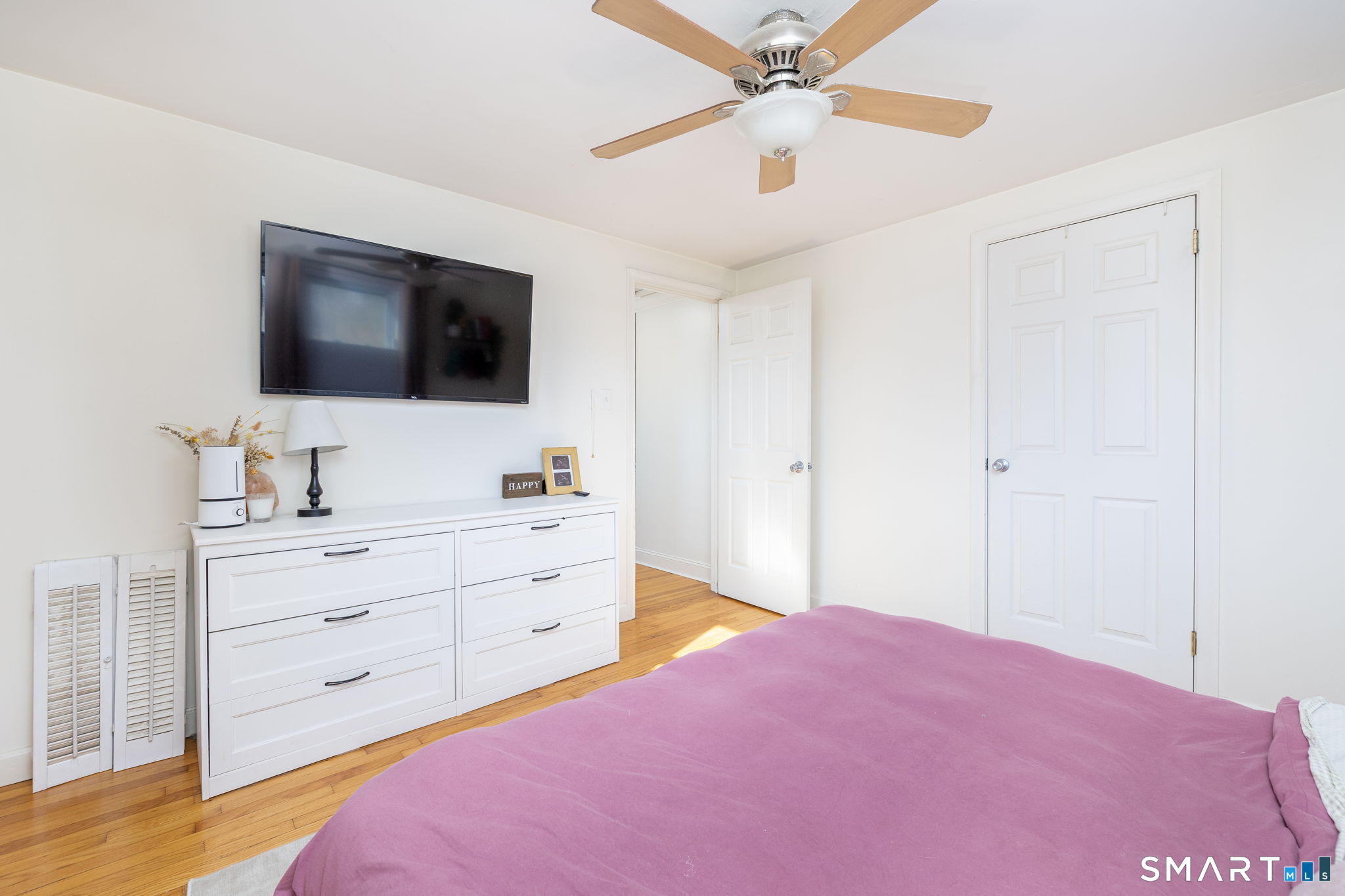 18 Debra Lane Bristol, CT 06010 - Photo 15 of 32 a bedroom with a large bed and a flat screen tv