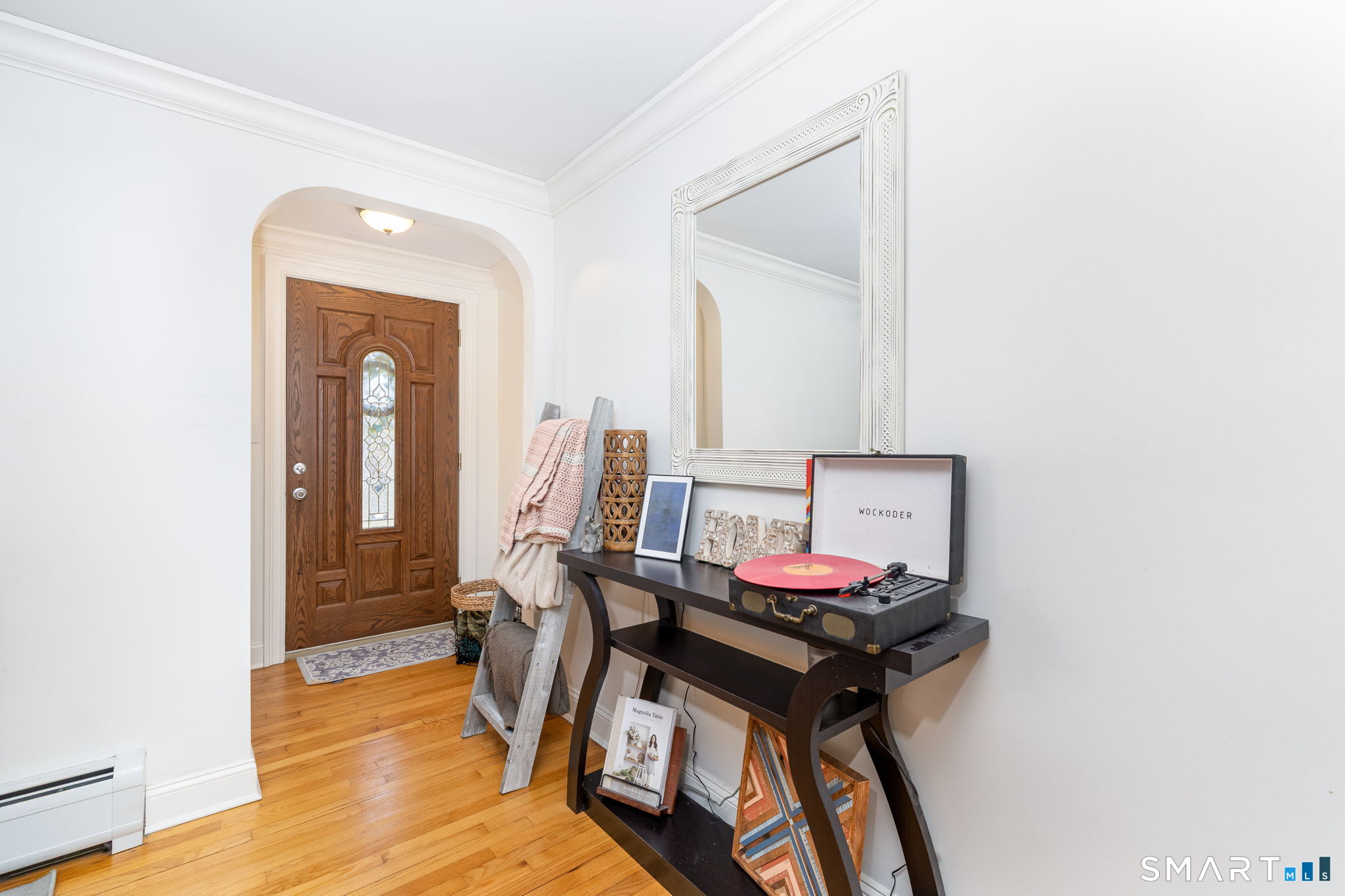 18 Debra Lane Bristol, CT 06010 - Photo 10 of 32 a view of a hallway with furniture and a mirror