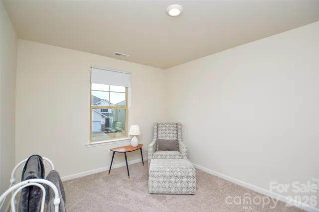 a view of a room with a window and couch