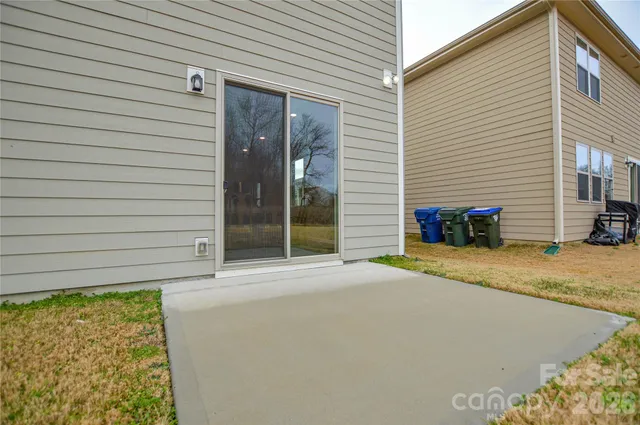 a view of a backyard with a garage