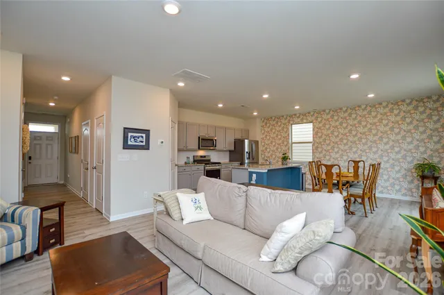 a living room with furniture and a table