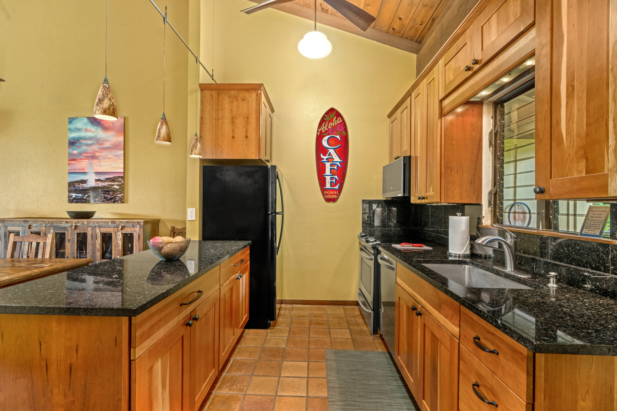 1870 Hoone Road, Unit 602 Koloa, HI 96756 - Photo 3 of 26 a kitchen with stainless steel appliances granite countertop a sink stove and refrigerator