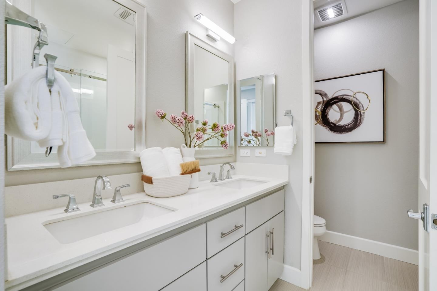 415 Franklin Parkway San Mateo, CA 94403 - Photo 17 of 31 a bathroom with a granite countertop sink and a mirror