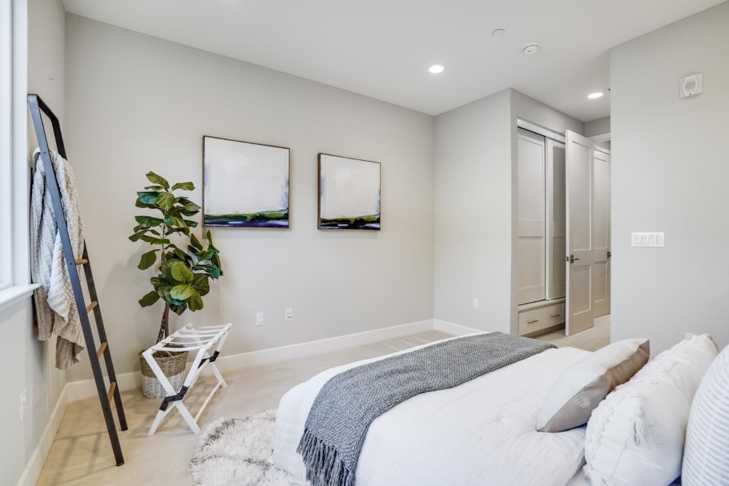 415 Franklin Parkway San Mateo, CA 94403 - Photo 20 of 31 a bedroom with a bed and a potted plant