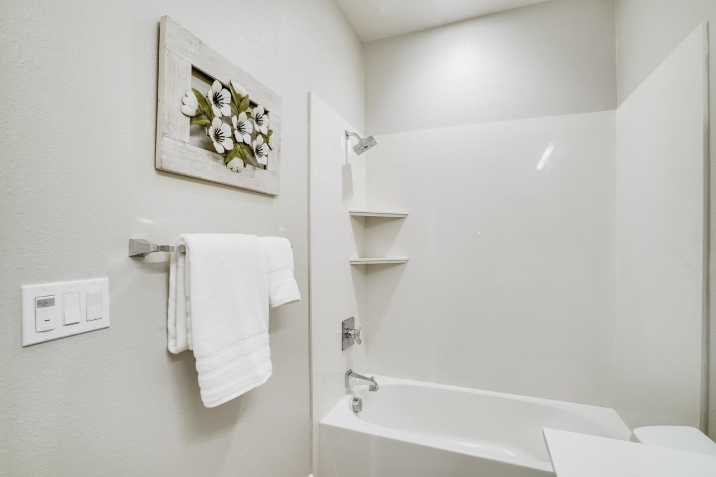 415 Franklin Parkway San Mateo, CA 94403 - Photo 22 of 31 a bathroom with a bathtub and a shower