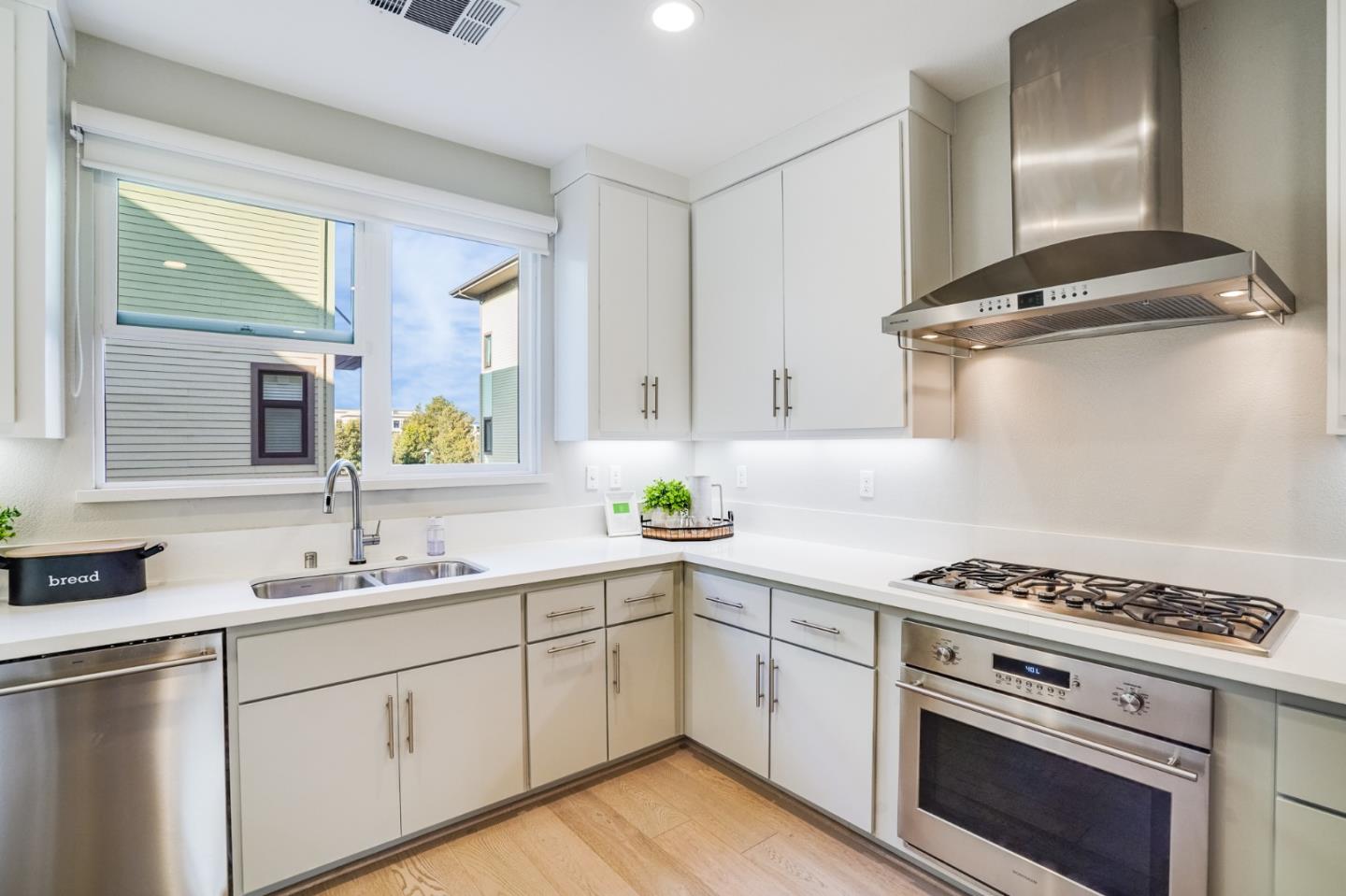 415 Franklin Parkway San Mateo, CA 94403 - Photo 10 of 31 a kitchen with cabinets appliances and a window
