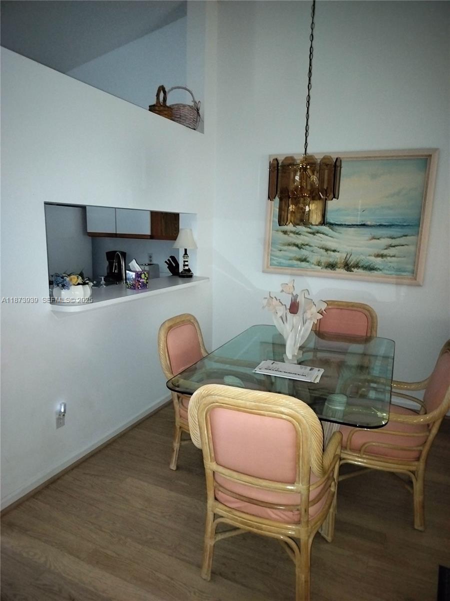 1002 Keystone Drive, Unit F Jupiter, FL 33458 - Photo 4 of 10 a dining room with furniture and window