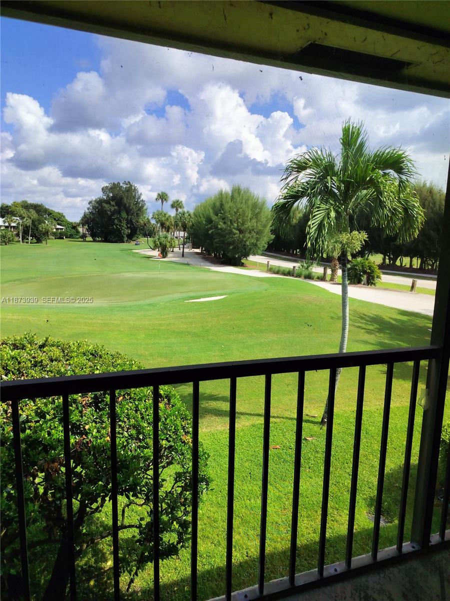 1002 Keystone Drive, Unit F Jupiter, FL 33458 - Photo 9 of 10 a view of green field with staircase