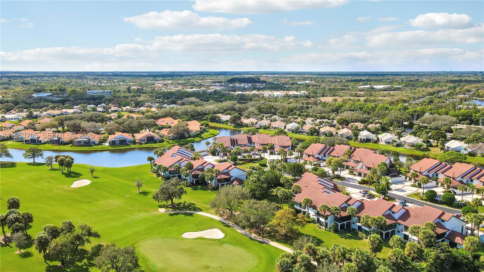 16600 Traders Crossing South, Unit 253 Jupiter, FL 33477 - Photo 18 of 67 an aerial view of residential houses with outdoor space