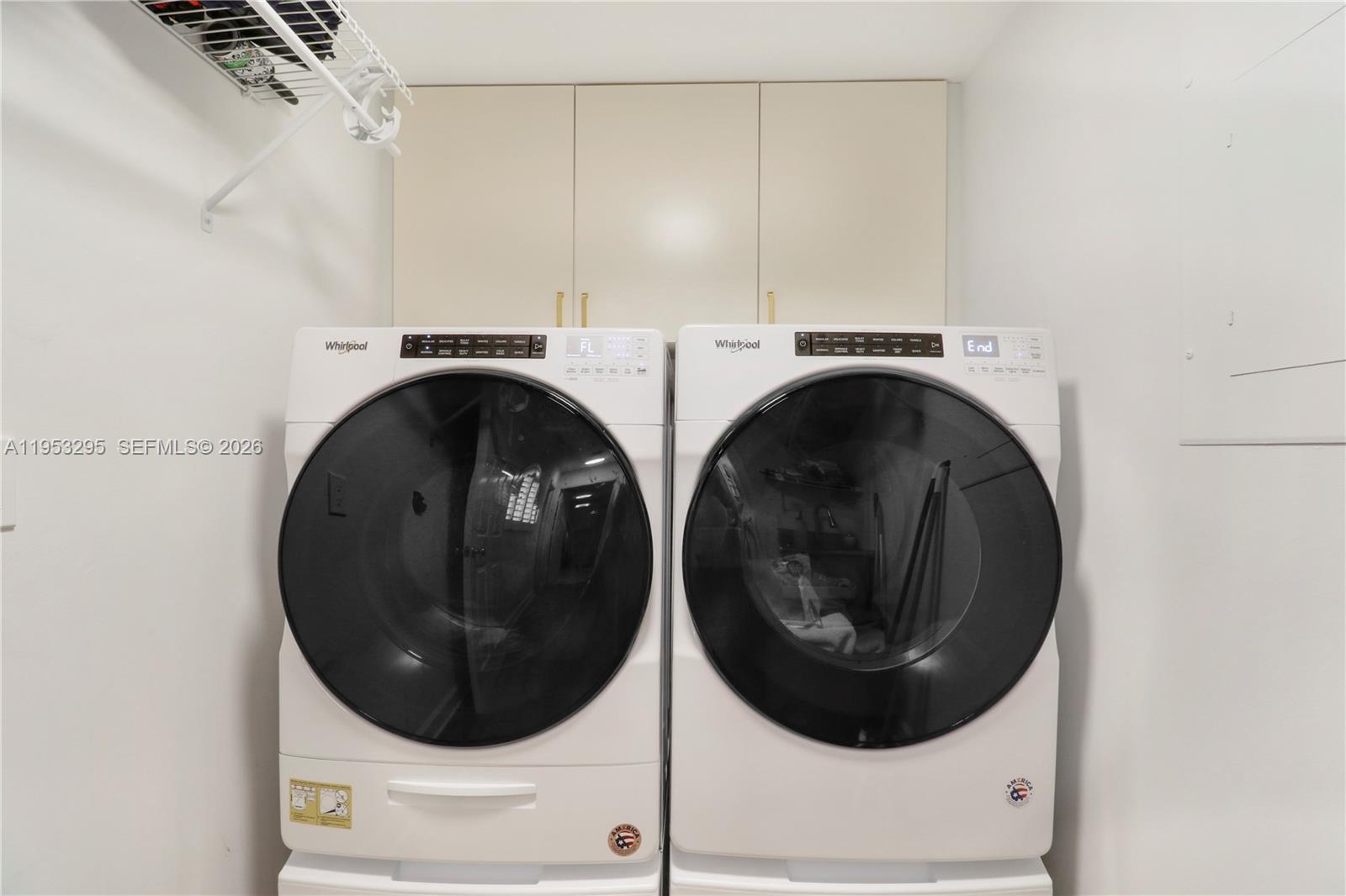 16600 Traders Crossing South, Unit 253 Jupiter, FL 33477 - Photo 33 of 67 a utility room with dryer and washer