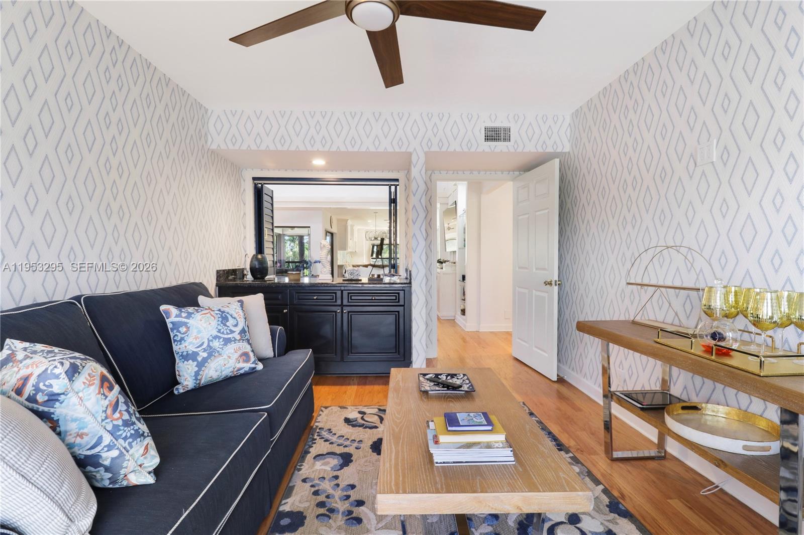 16600 Traders Crossing South, Unit 253 Jupiter, FL 33477 - Photo 38 of 67 a living room with furniture and a rug