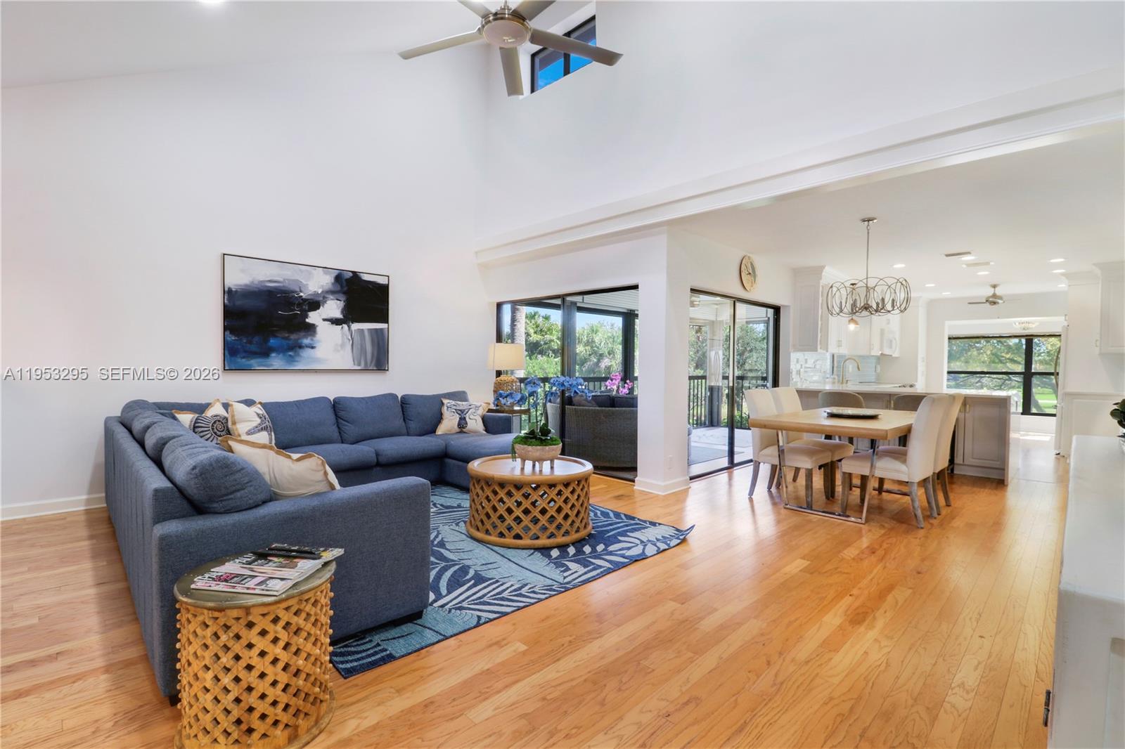 16600 Traders Crossing South, Unit 253 Jupiter, FL 33477 - Photo 46 of 67 a living room with furniture and a flat screen tv