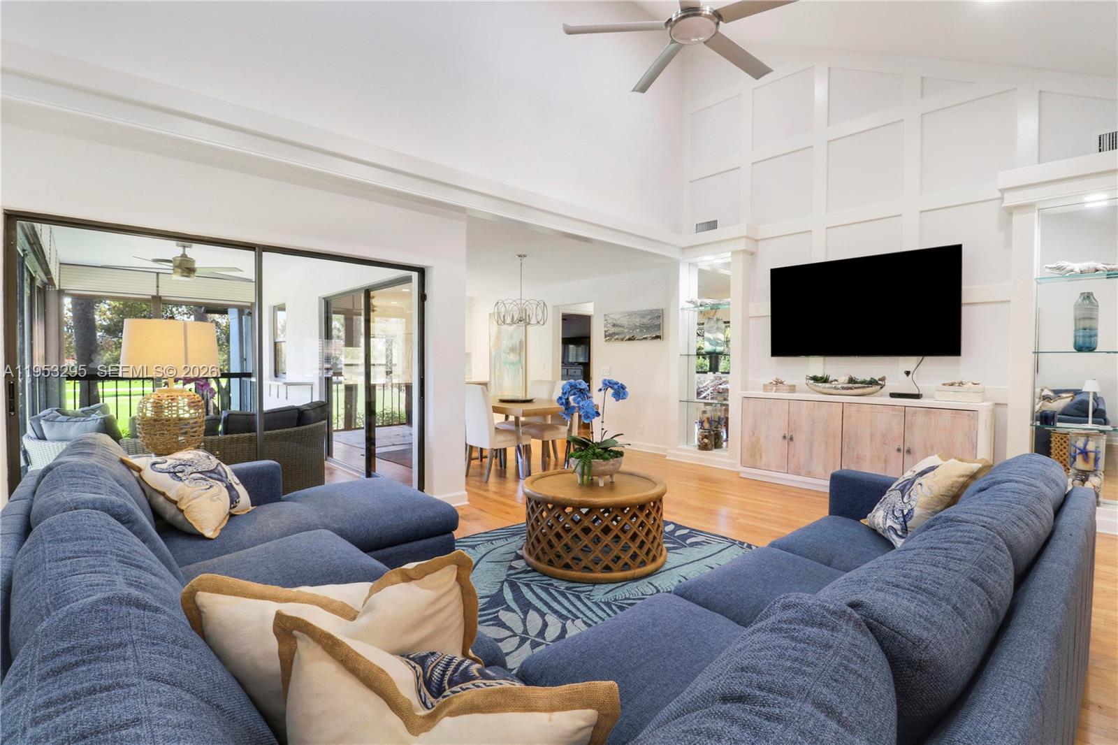 16600 Traders Crossing South, Unit 253 Jupiter, FL 33477 - Photo 47 of 67 a living room with furniture and a flat screen tv