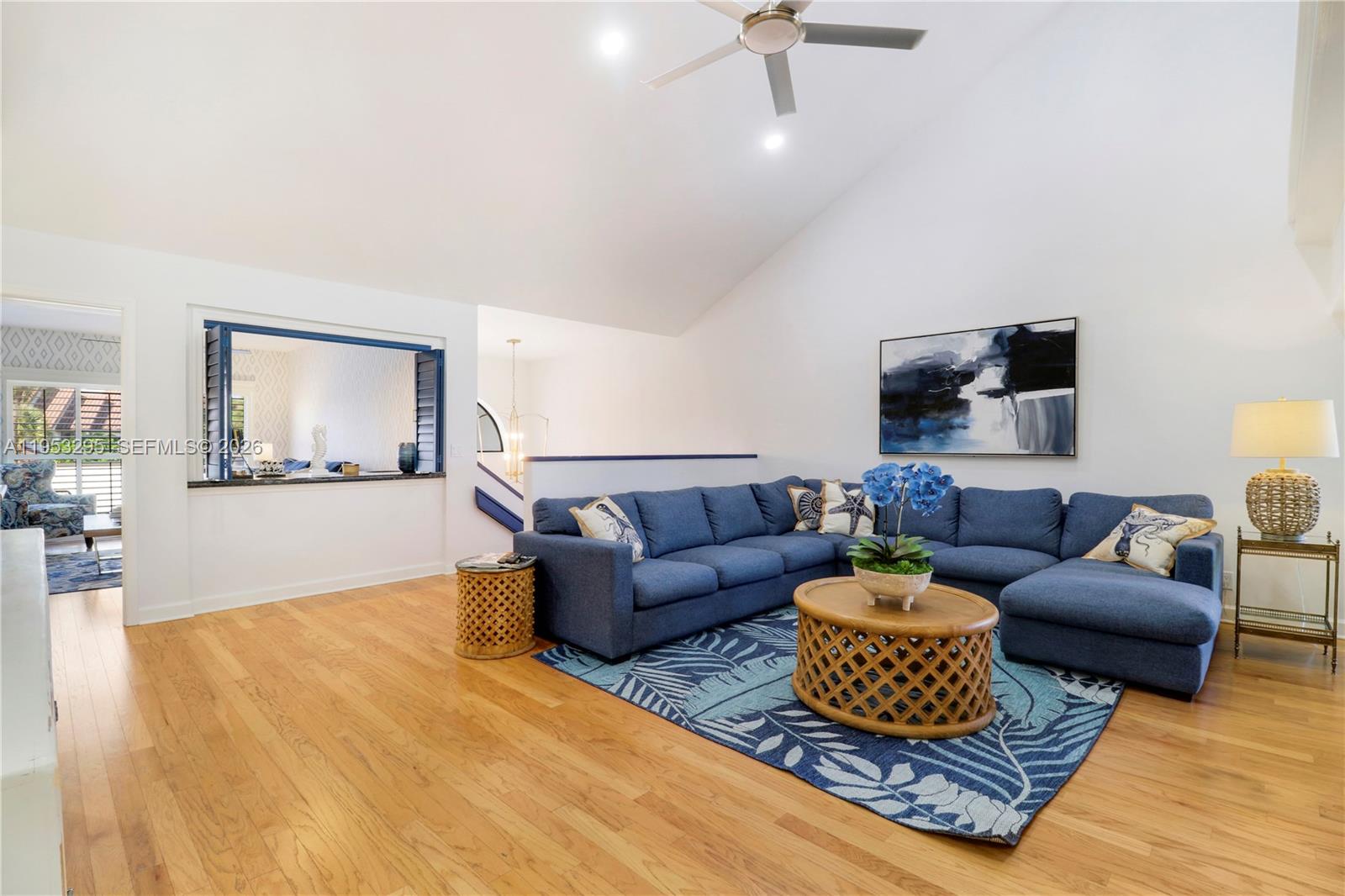 16600 Traders Crossing South, Unit 253 Jupiter, FL 33477 - Photo 48 of 67 a living room with furniture and a flat screen tv