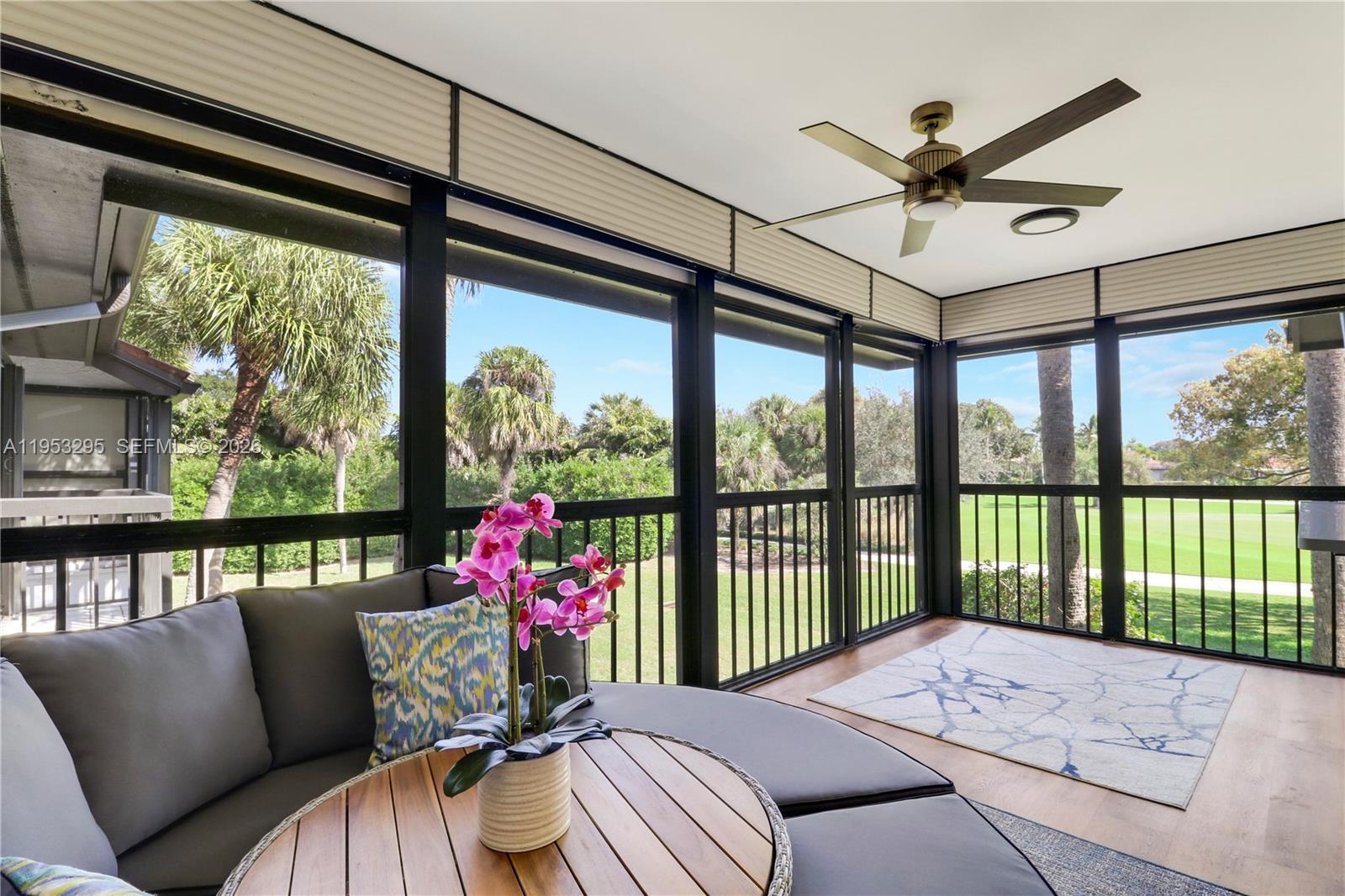 16600 Traders Crossing South, Unit 253 Jupiter, FL 33477 - Photo 59 of 67 a living room with furniture and a large window