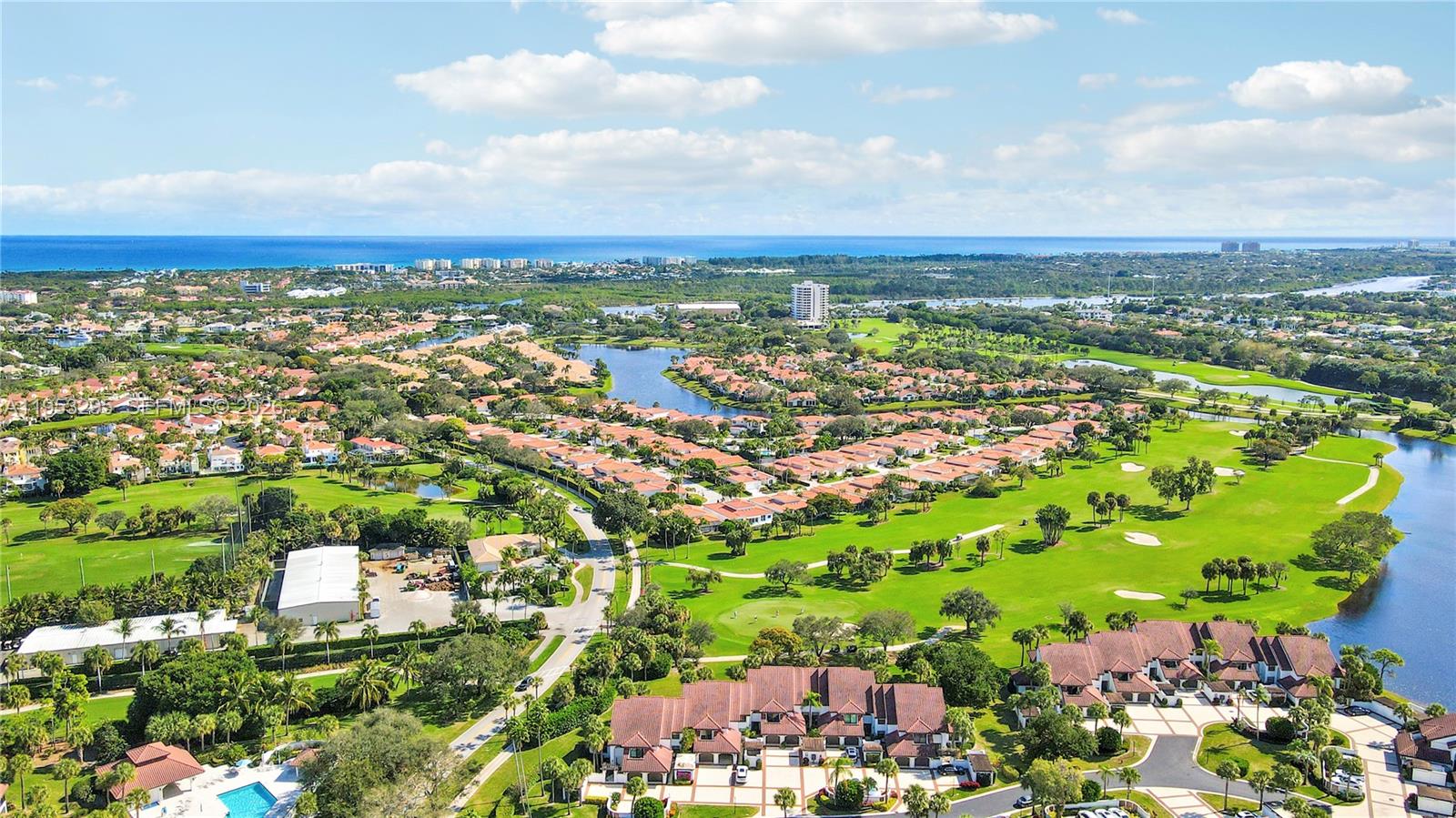 16600 Traders Crossing South, Unit 253 Jupiter, FL 33477 - Photo 8 of 67 an aerial view of residential houses with outdoor space and trees