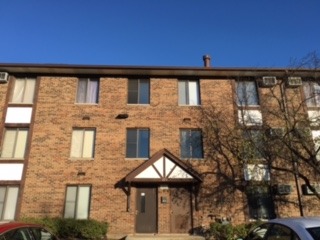 a front view of a house with large windows