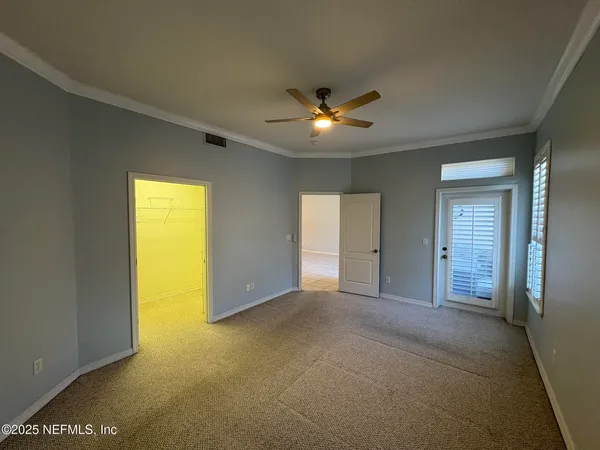 a spacious bathroom with a granite countertop sink mirror and bathtub