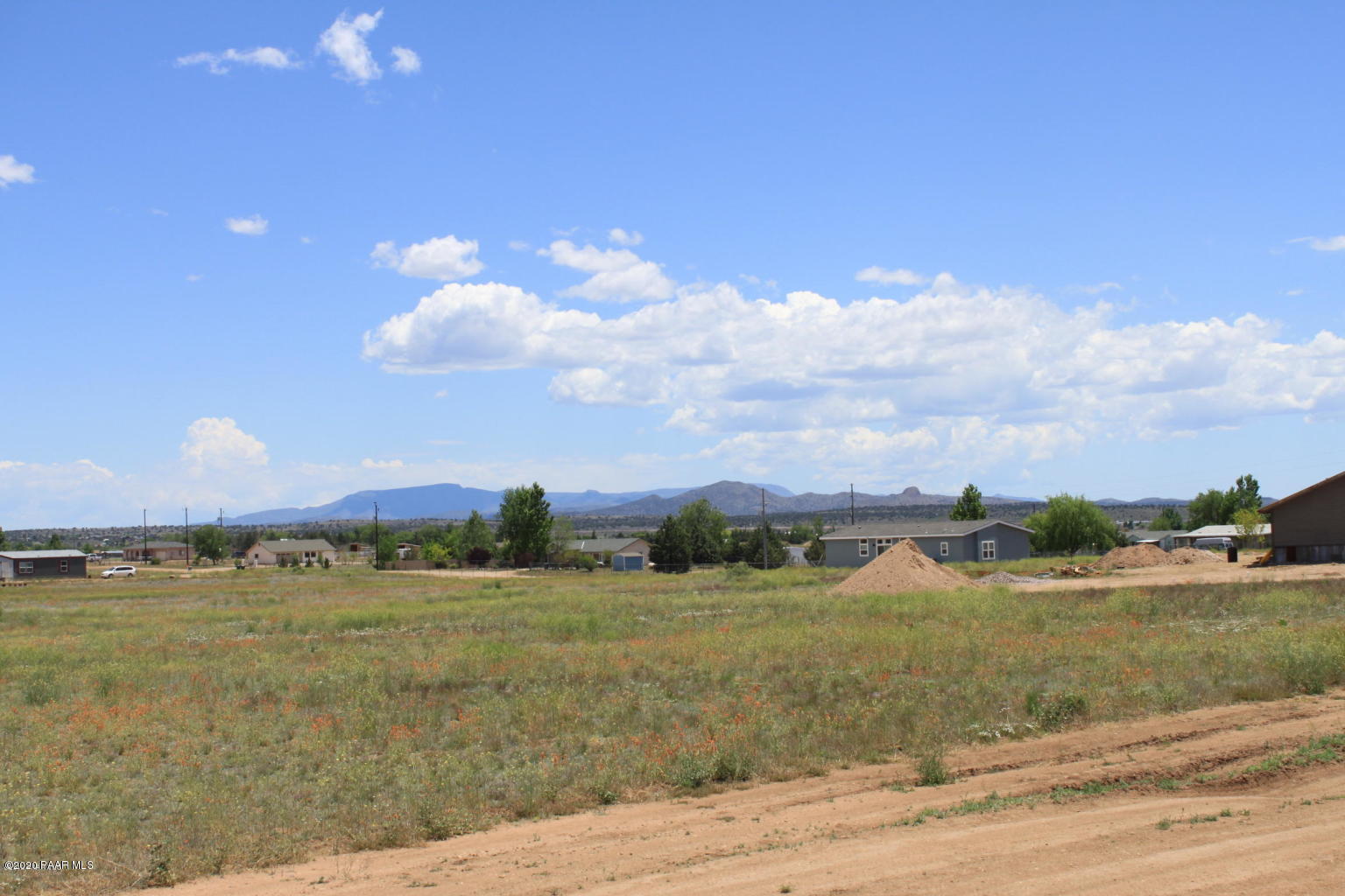 25580 North High Desert Road Paulden, AZ 86334 - Photo 14 of 18 a view of a lake with houses in the background