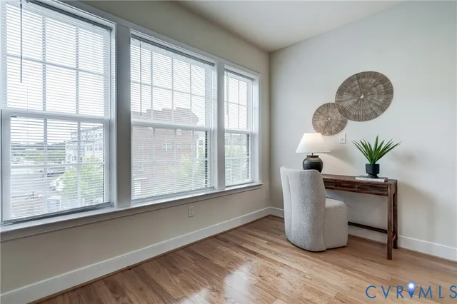 a view of a room with furniture and a window