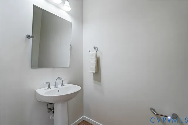 a bathroom with a sink and mirror