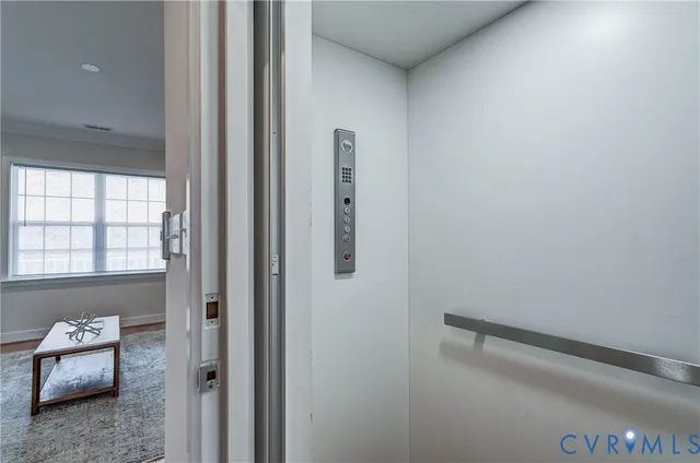 a spacious bedroom with a bed and window