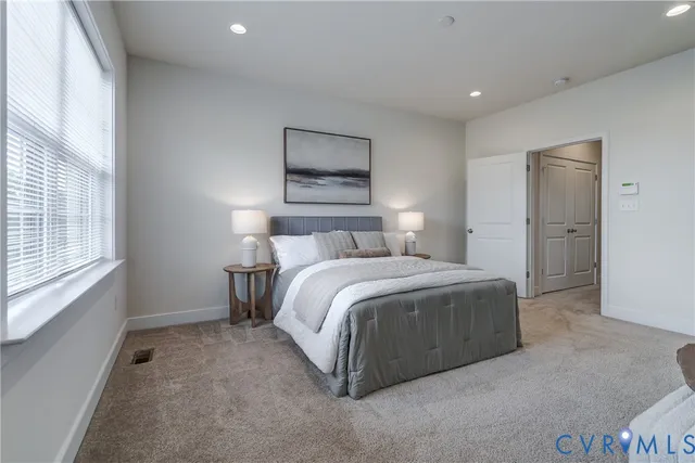 a bedroom with a bed and a couch