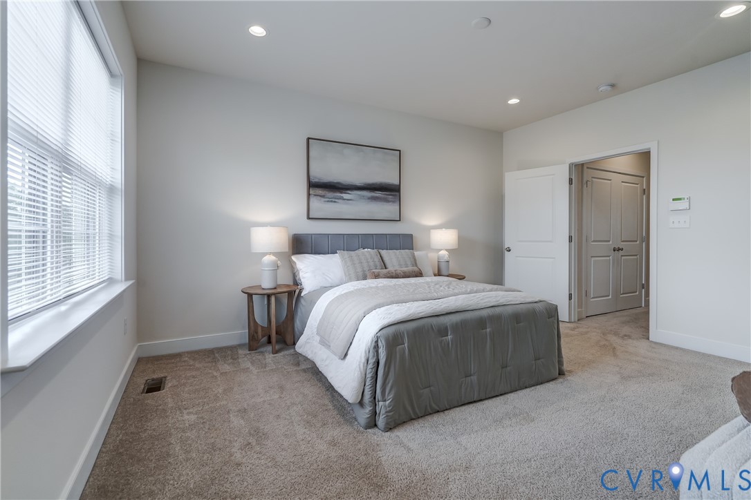 2006 Libbie Lake W Street, Unit B Richmond, VA 23230 - Photo 26 of 43 a bedroom with a bed and a large window