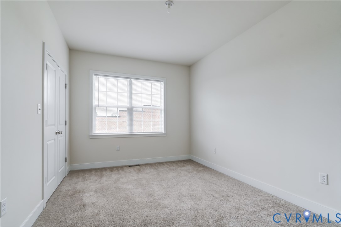 2006 Libbie Lake W Street, Unit B Richmond, VA 23230 - Photo 34 of 43 an empty room with a window