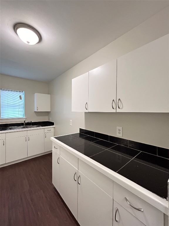 3629 North MacGregor Way, Unit 131 Houston, TX 77004 - Photo 8 of 13 a white kitchen with sink and cabinets