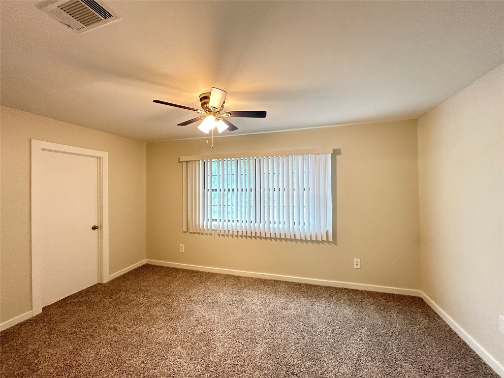3629 North MacGregor Way, Unit 131 Houston, TX 77004 - Photo 9 of 13 a view of an empty room with a window