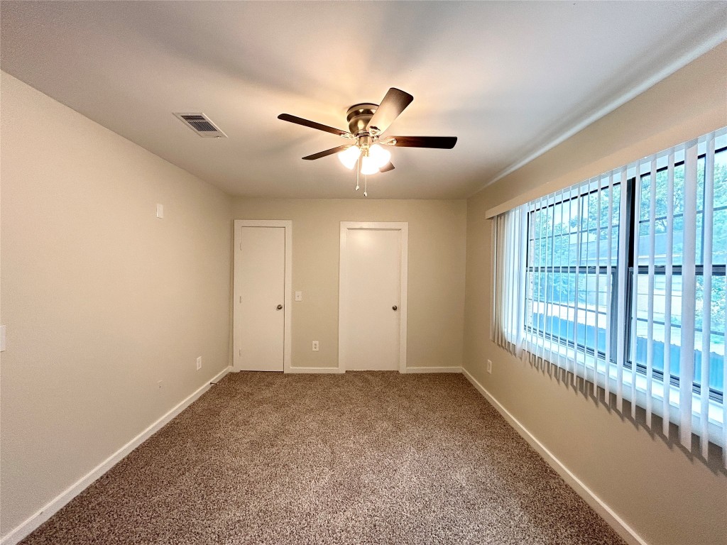 3629 North MacGregor Way, Unit 131 Houston, TX 77004 - Photo 10 of 13 a view of a livingroom with a ceiling fan and window