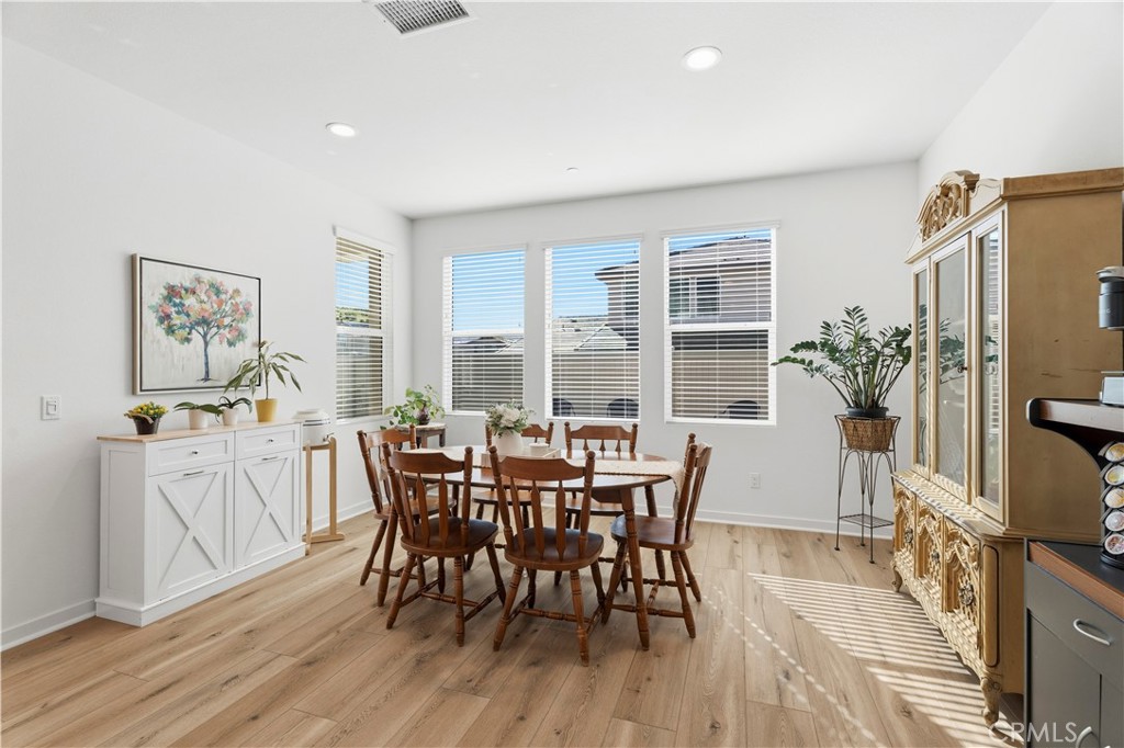18100 Tableau Way Saugus, CA 91350 - Photo 17 of 63 a view of a dining room with furniture window and wooden floor