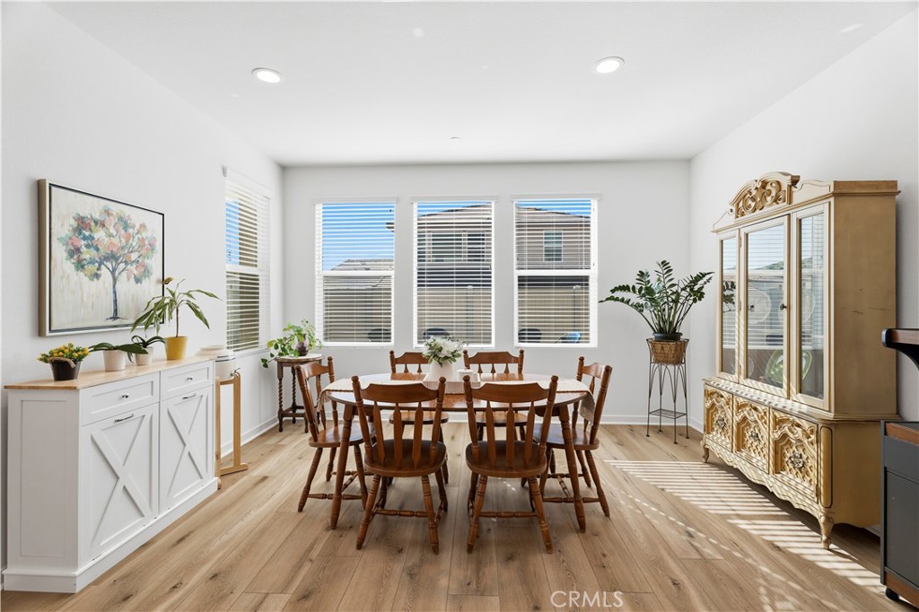 18100 Tableau Way Saugus, CA 91350 - Photo 18 of 63 a view of a dining room with furniture window and wooden floor