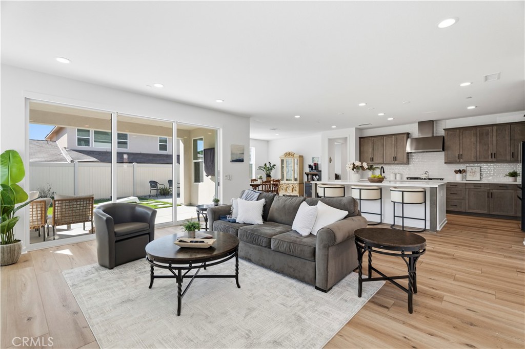 18100 Tableau Way Saugus, CA 91350 - Photo 20 of 63 a living room with furniture and kitchen view